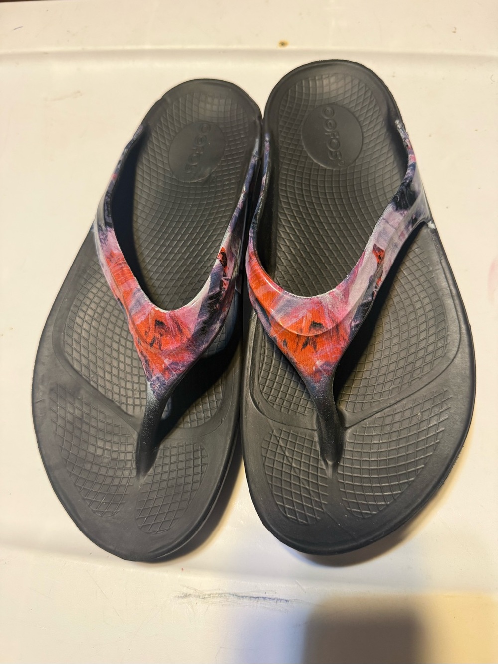 Black Flip Flop Sandals with Multicolor Strap - Women. Oofos